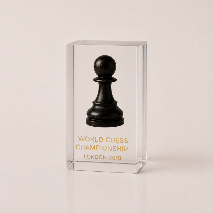 Black chess pawn in a clear glass case with &